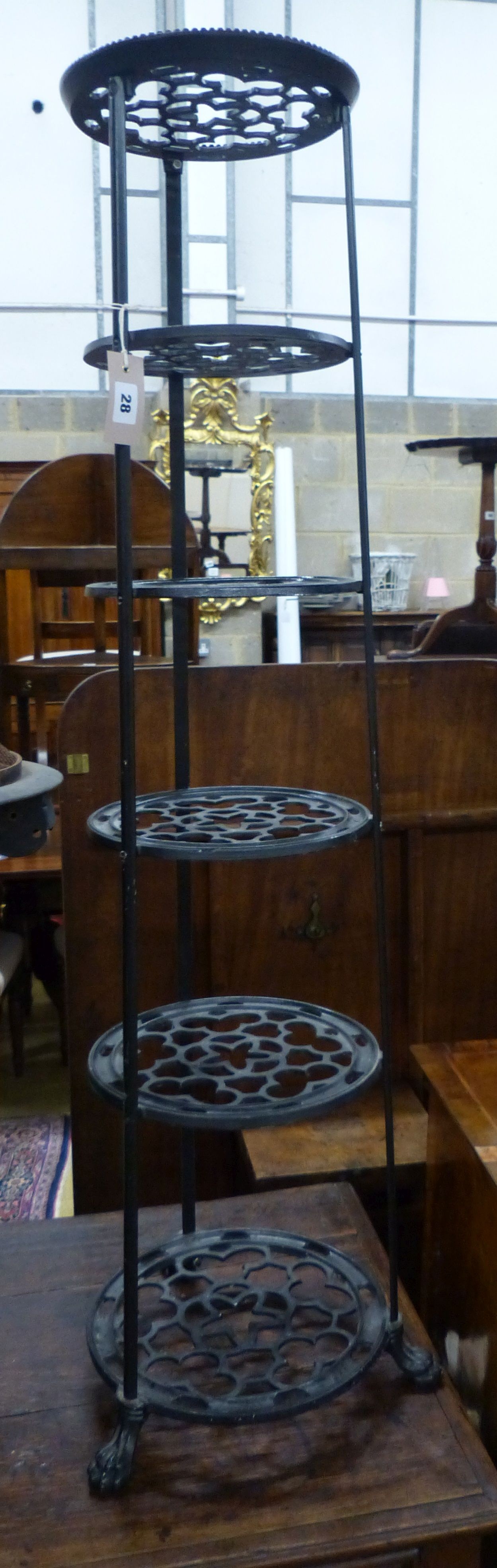 A Victorian style cast metal six tier pot stand, H.126cm